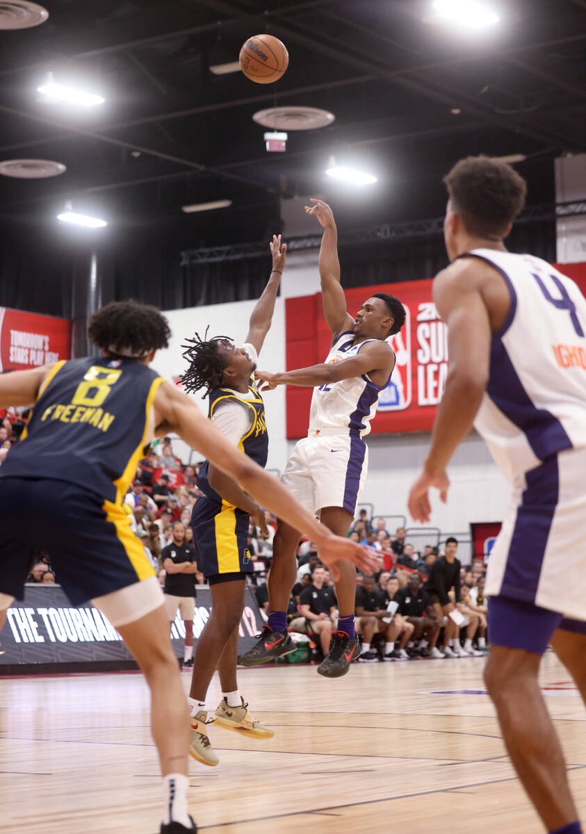 Phoenix Suns guard Tyson Walker (12) shoots over Indiana Pacers guard Tristen Newton (4) during ...