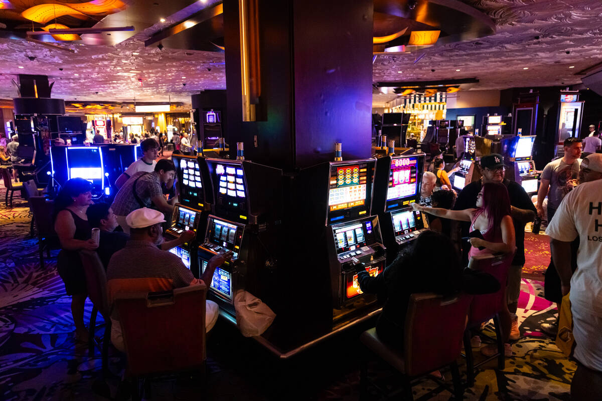 People play slot machines during the final night of operations and gaming at The Mirage on Tues ...