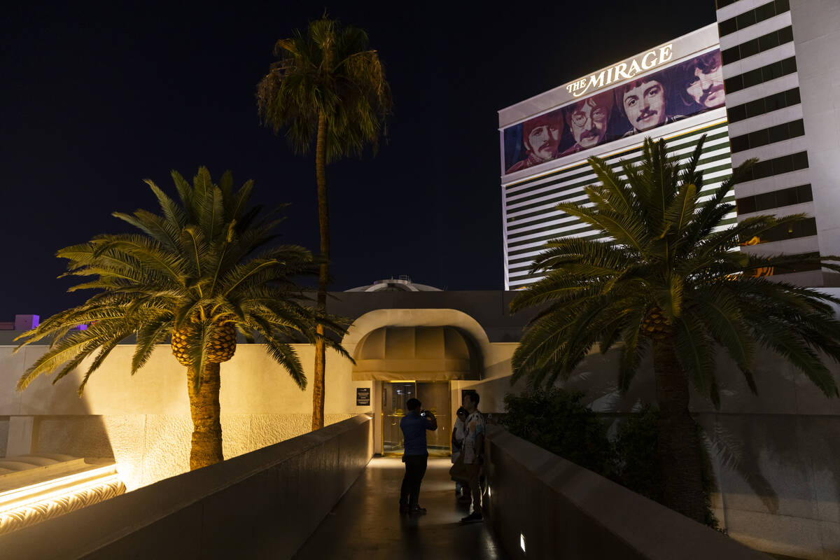 People take photos outside during the final night of operations and gaming at The Mirage in the ...