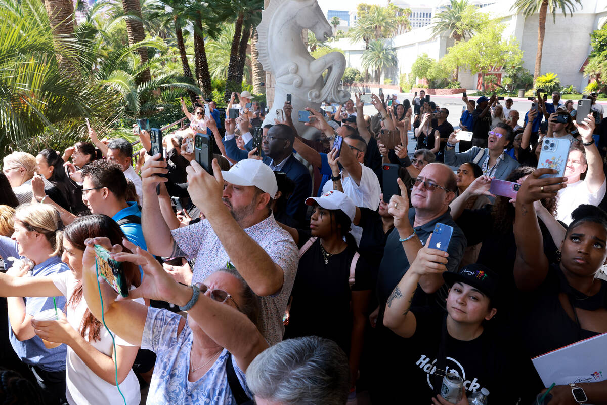 The Mirage guests and employees watch the final volcano show on the final day of operations at ...