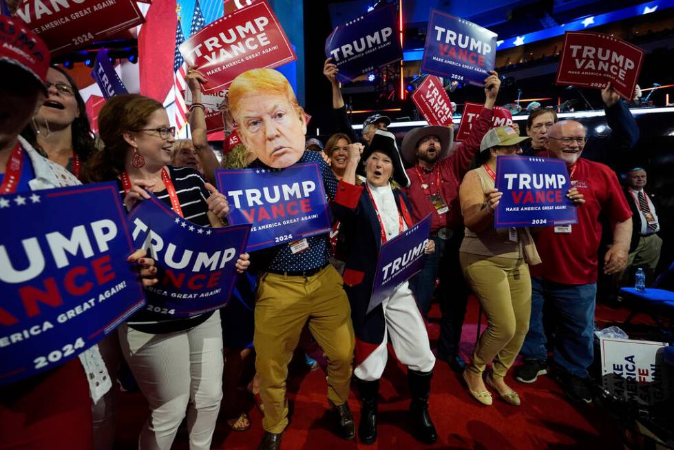 Delegates dance around during the Republican National Convention Tuesday, July 16, 2024, in Mil ...