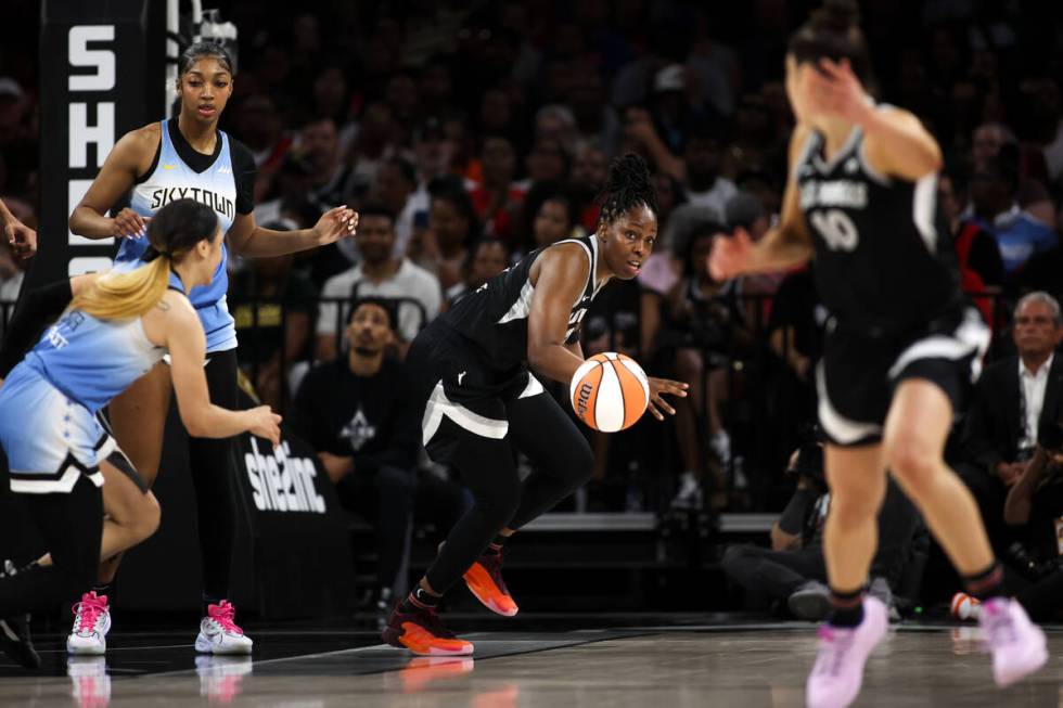 Las Vegas Aces guard Chelsea Gray (12) steals the ball from Chicago Sky guard Chennedy Carter, ...