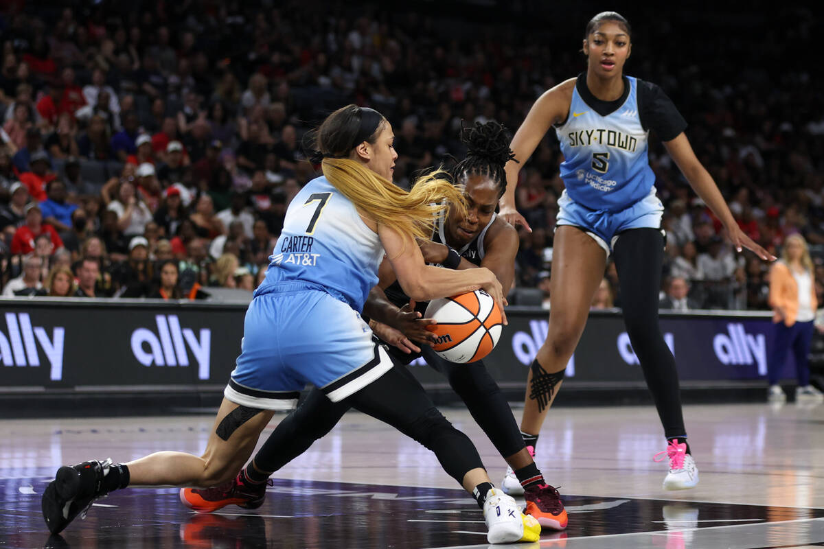 Chicago Sky guard Chennedy Carter (7) steals the ball from Las Vegas Aces guard Chelsea Gray, c ...