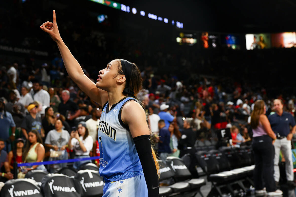 Chicago Sky guard Chennedy Carter points upward after winning a WNBA basketball game against th ...
