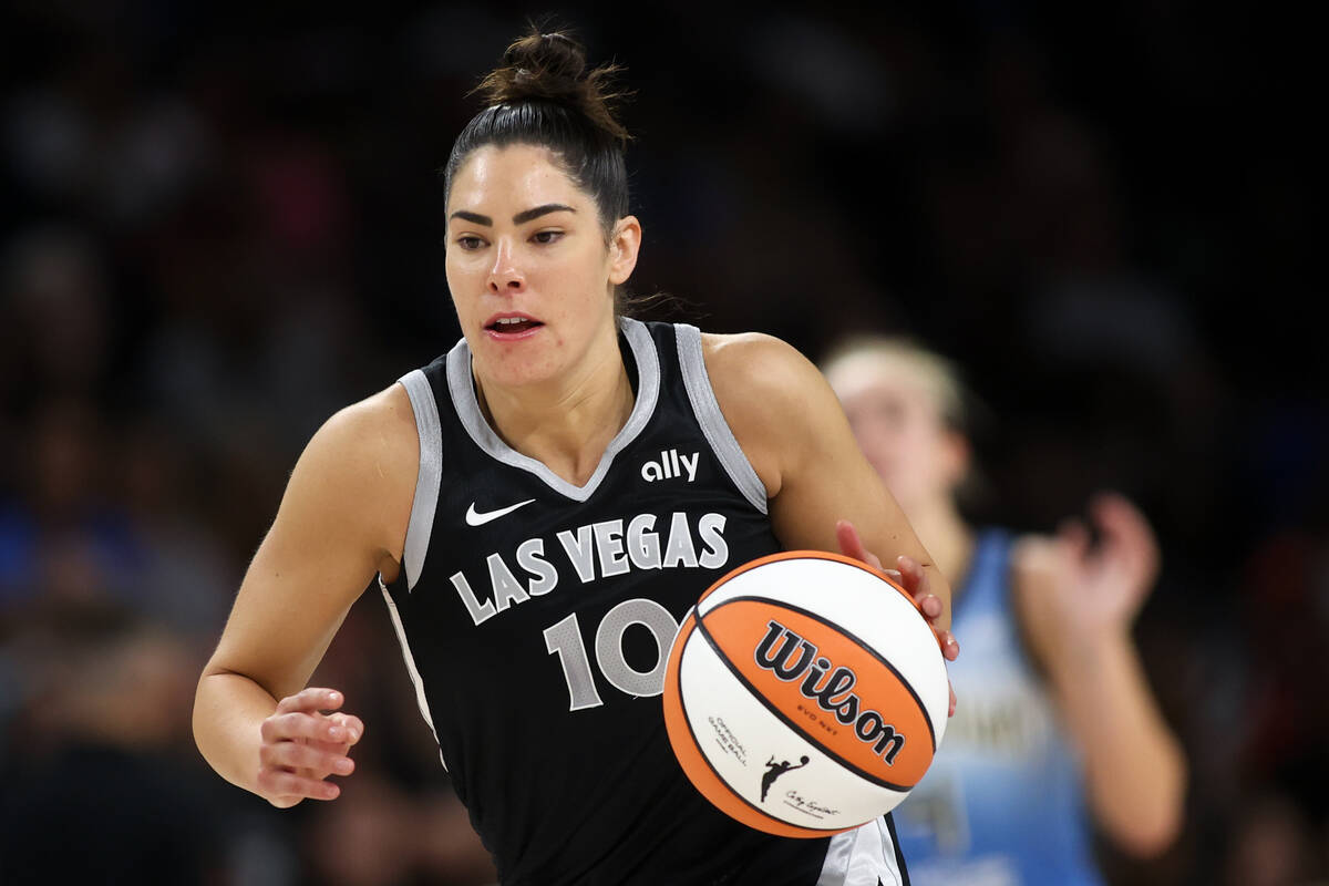 Las Vegas Aces guard Kelsey Plum (10) dribbles up the court during the first half of a WNBA bas ...