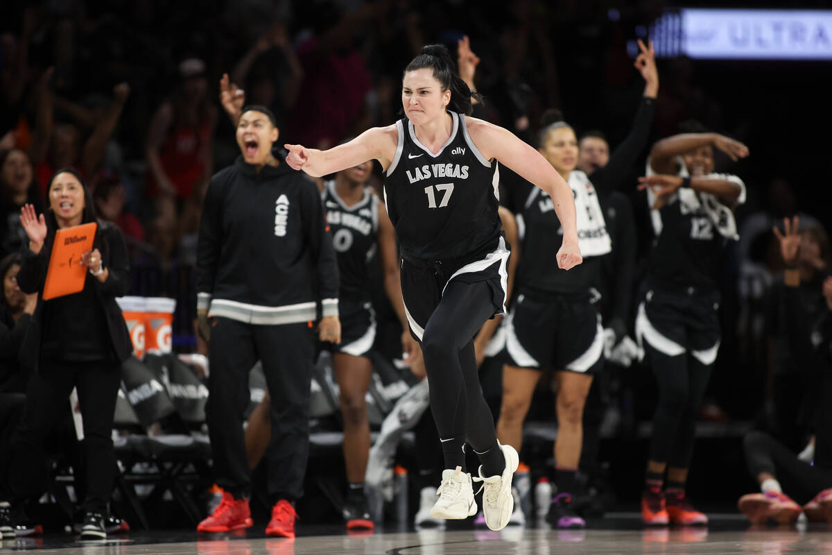 Las Vegas Aces center Megan Gustafson (17) celebrates after scoring during the second half of a ...