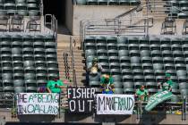 Oakland Athletics fans in the upper deck of the right field display banners in discontent with ...