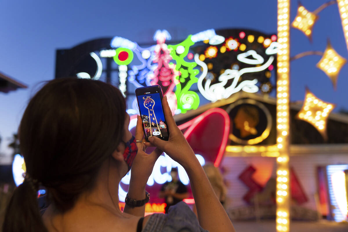Kristine Bressel takes a photo during a tour at The Neon Museum on Friday, May 22, 2020, in Las ...