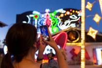 Kristine Bressel takes a photo during a tour at The Neon Museum on Friday, May 22, 2020, in Las ...