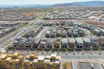 Construction is underway for new development as existing homes are seen from the Desert Foothil ...