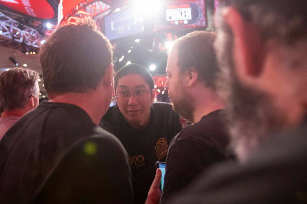 Jonathan Tamayo talks to family and friends while competing in the final table of the World Ser ...