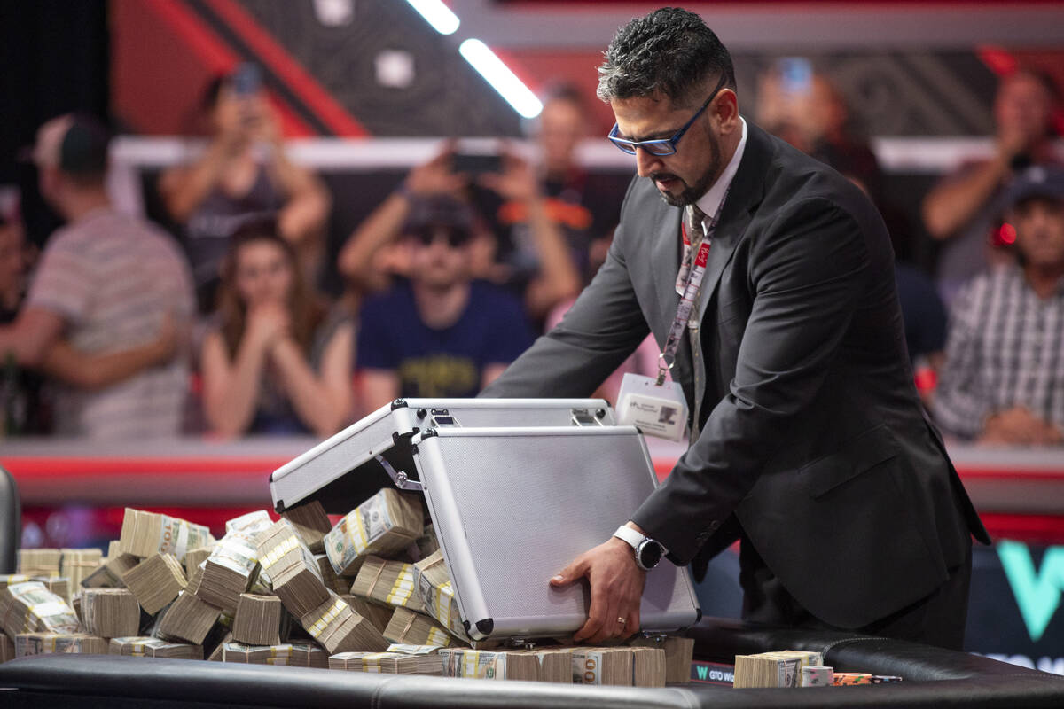 The cash prize is dumped out of briefcases onto the final table of the World Series of Poker Ma ...