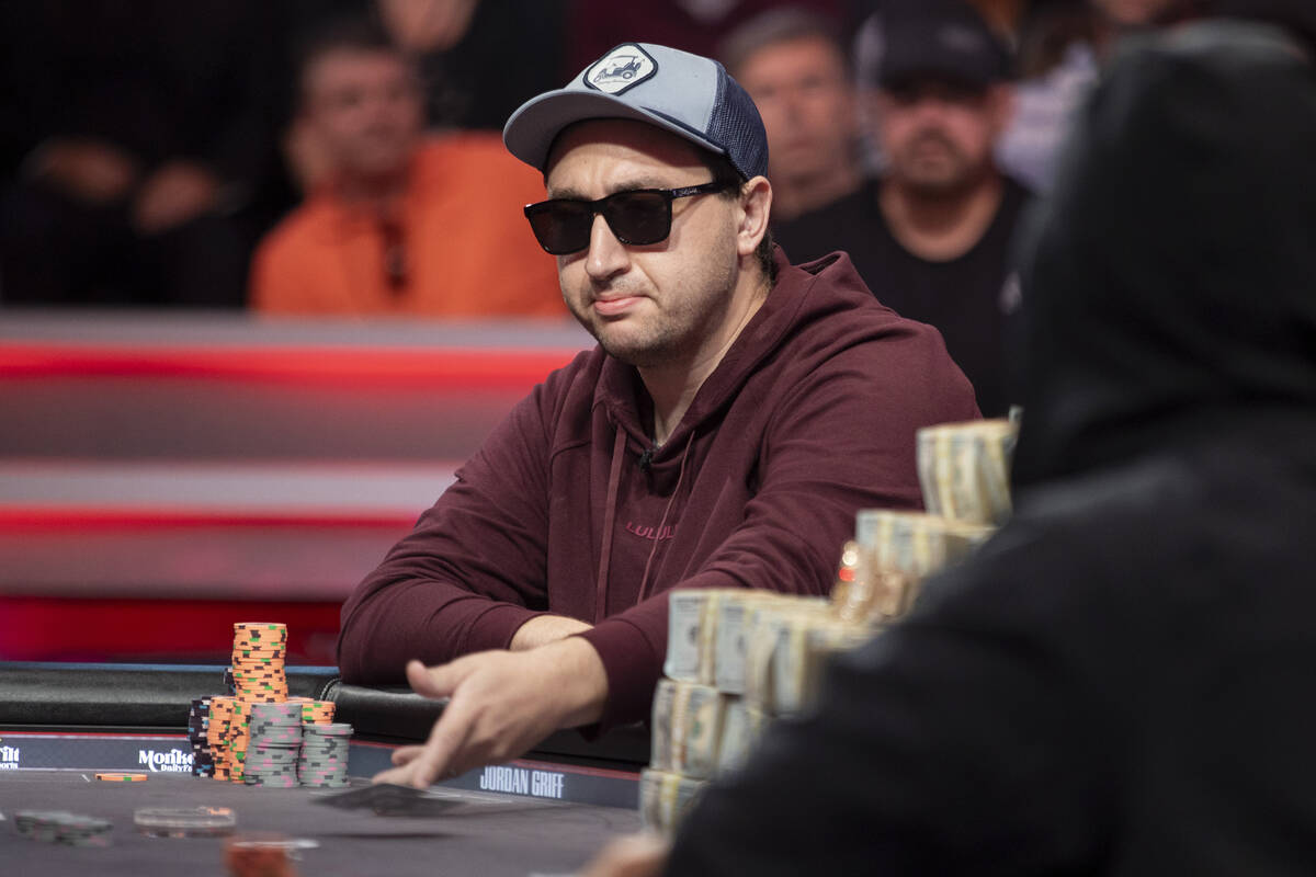 Jordan Griff tosses his cards while competing in the final table of the World Series of Poker M ...