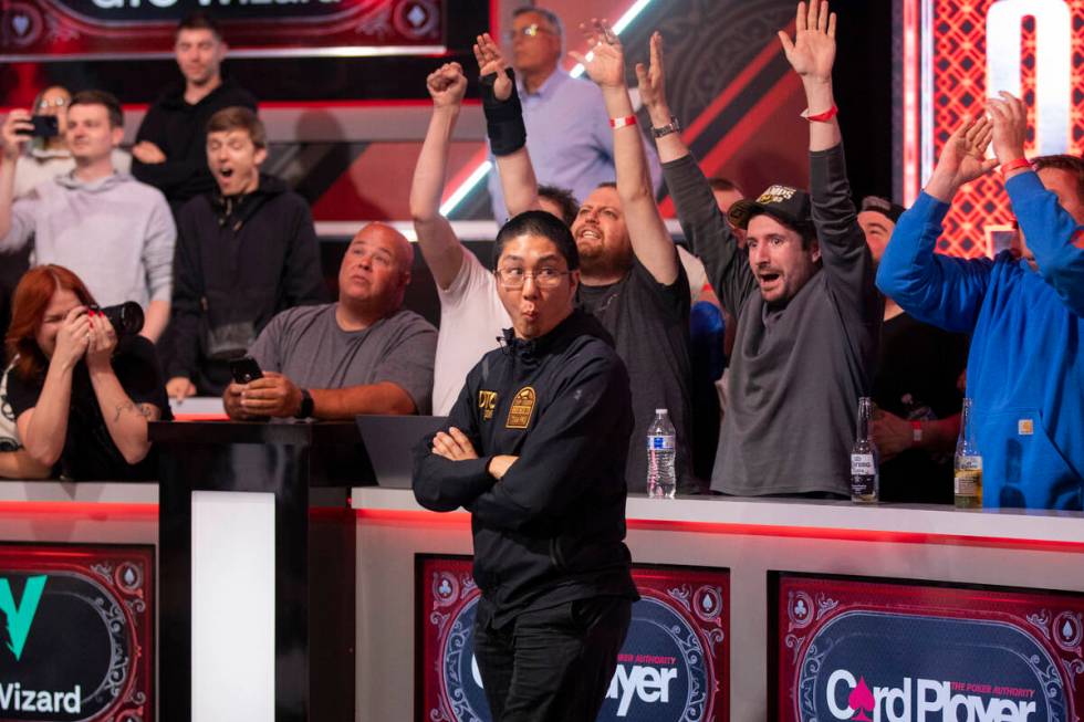Jonathan Tamayo, center, is surprised after winning a hand in the final table of the World Seri ...