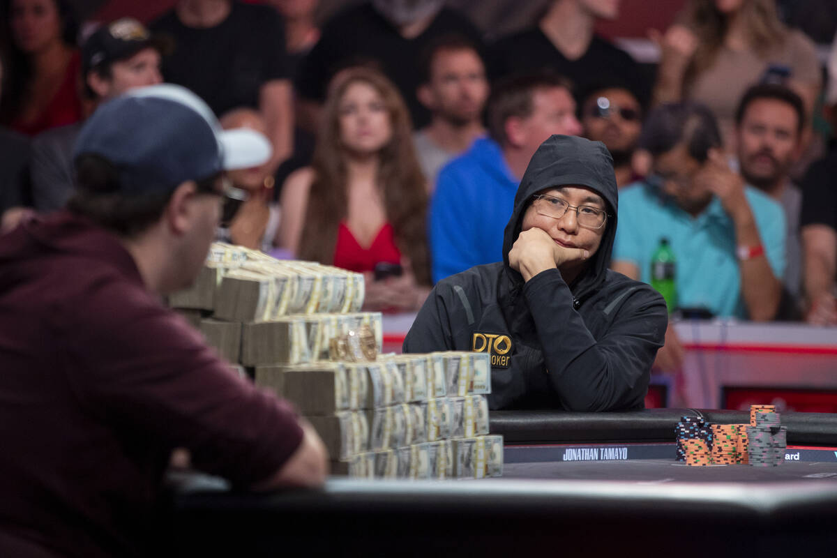 Jonathan Tamayo, right, watches Jordan Griff, left, compete in the final table of the World Ser ...