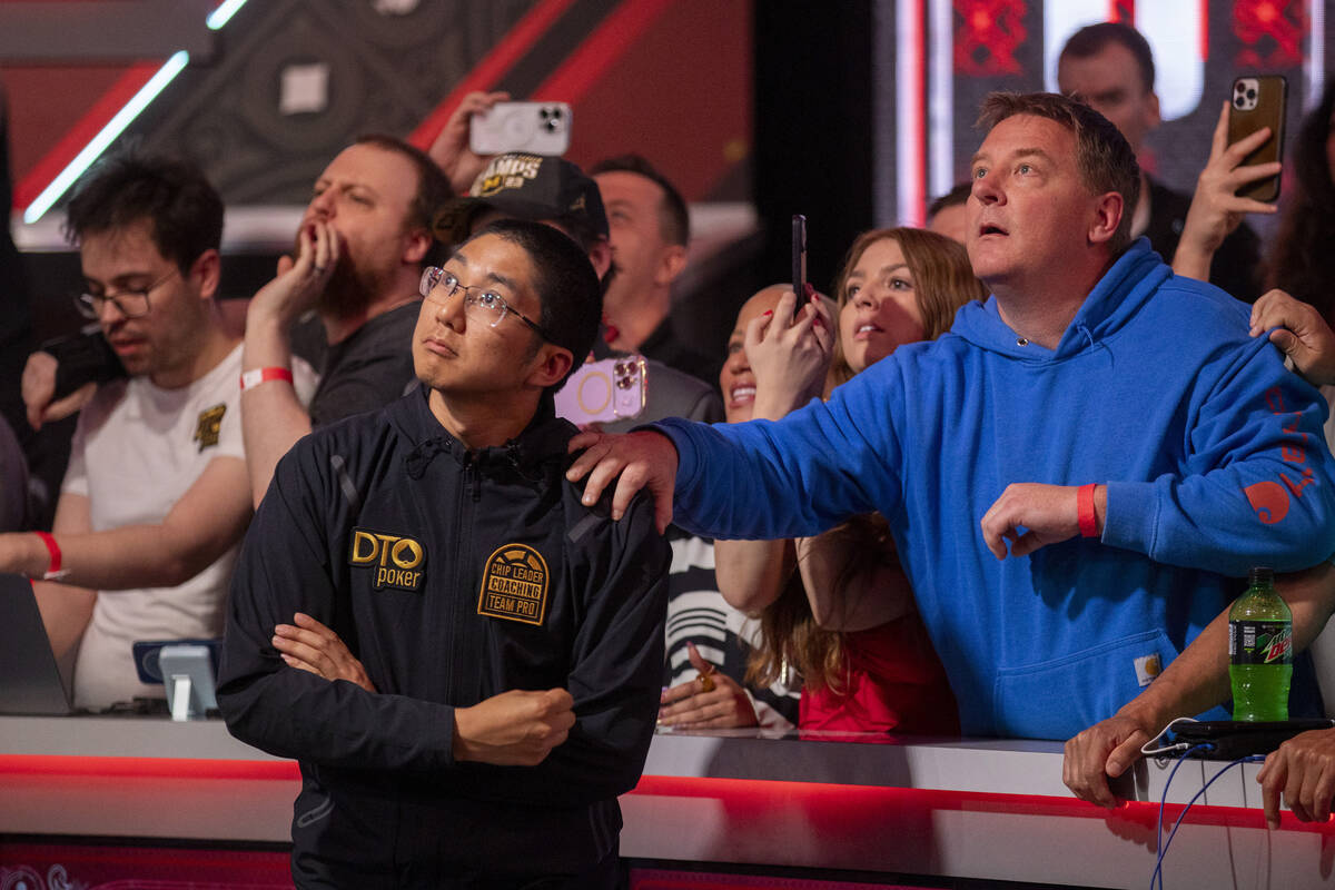 Jonathan Tamayo, left, watches his hand play with family and friends in the final table of the ...