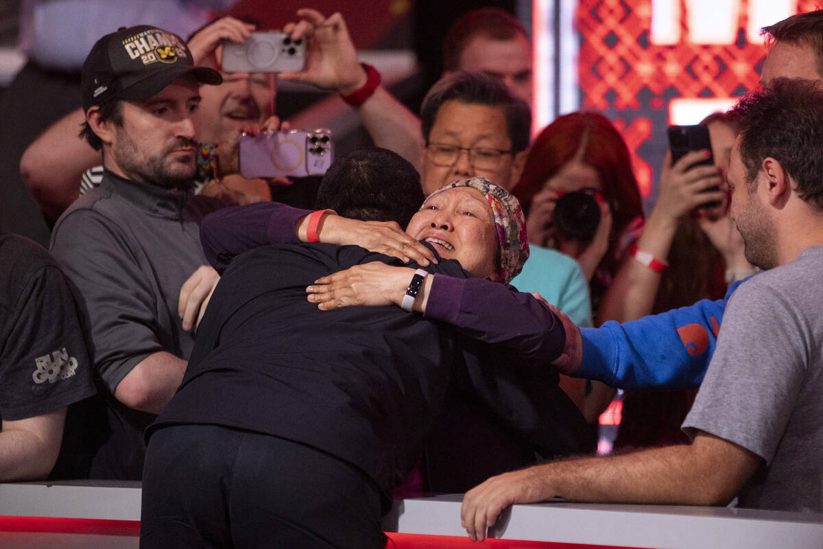 Jonathan Tamayo is hugged by his mother after winning the final table of the World Series of Po ...