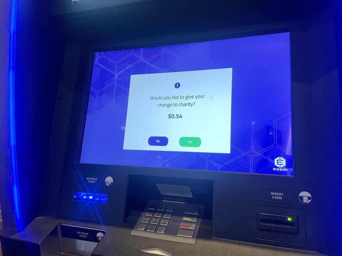 A ticket redemption machine asks whether the user wants to donate change to charity. Gamblers l ...