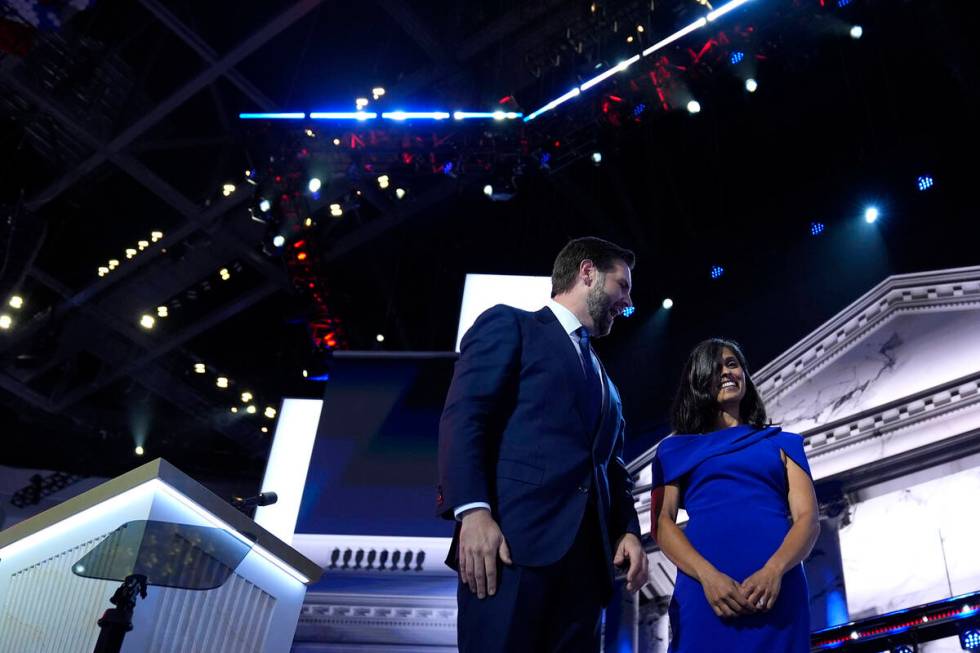 Republican vice presidential candidate Sen. JD Vance, R-Ohio, stands on stage with his wife Ush ...