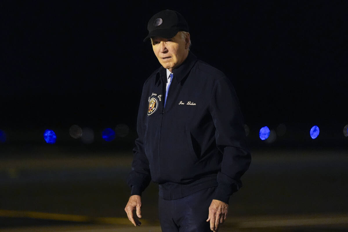 President Joe Biden walks to his car after stepping off of Air Force One at Dover Air Force Bas ...