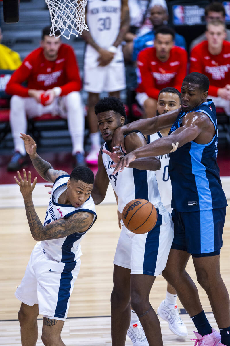New Orleans Pelicans and Memphis Grizzlies players battle for a loose ball during an NBA Summer ...