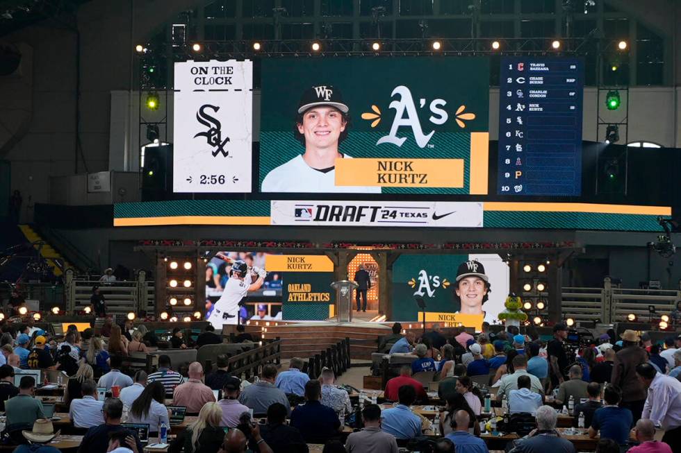 A photo of Nick Kurtz is shown on the large video board after the Oakland Athletics selected Ku ...