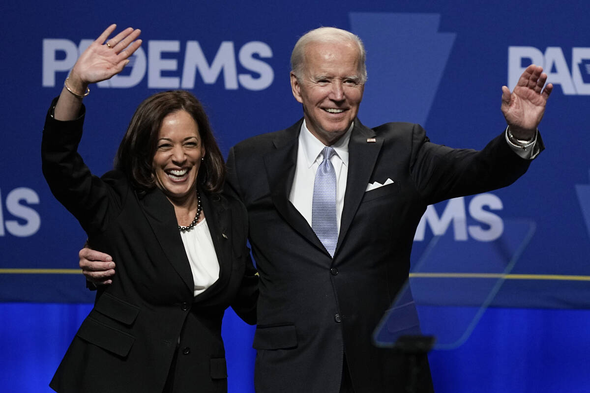 President Joe Biden waves with Vice President Kamala Harris at the Pennsylvania Democratic Part ...