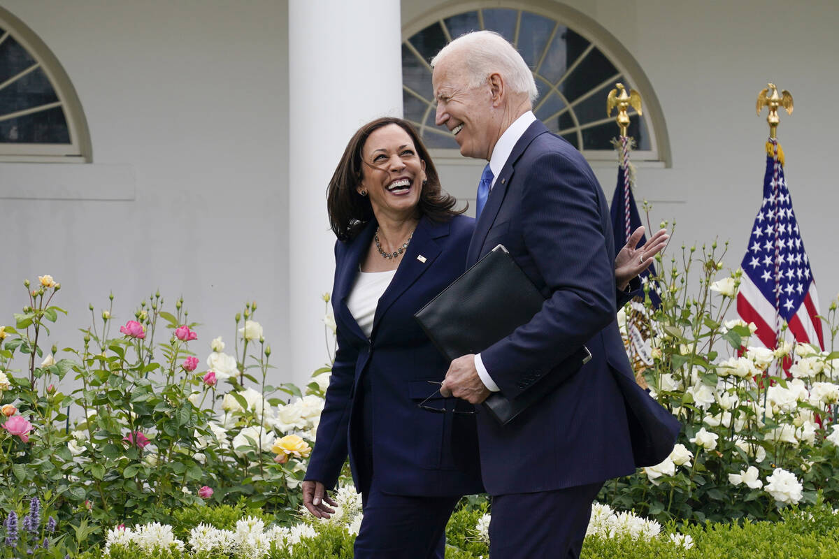 FILE - President Joe Biden, right, walks with Vice President Kamala Harris after speaking on up ...