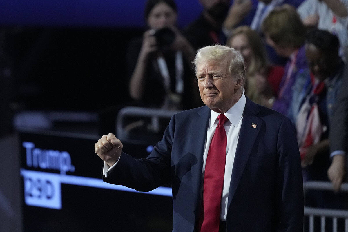 Republican presidential candidate former President Donald Trump gestures towards supporters dur ...