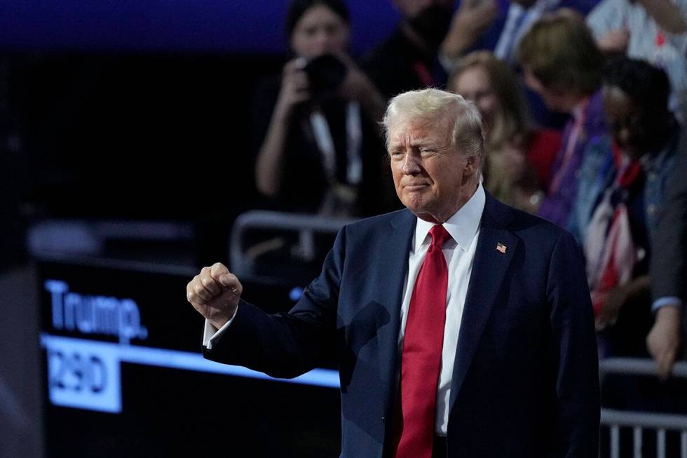 Republican presidential candidate former President Donald Trump gestures towards supporters dur ...