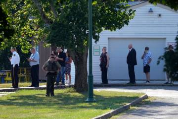 Visitors wait in line at the evening visitation session for Corey Comperatore, the former fire ...