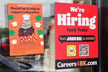 A hiring sign is displayed at a restaurant in Wheeling, Ill., May 16, 2024. (AP Photo/Nam Y. Hu ...