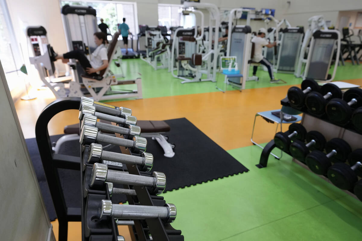 People work out at the Fukagawa Sports Center in Tokyo, Wednesday, June 12, 2024. (AP Photo/Hir ...
