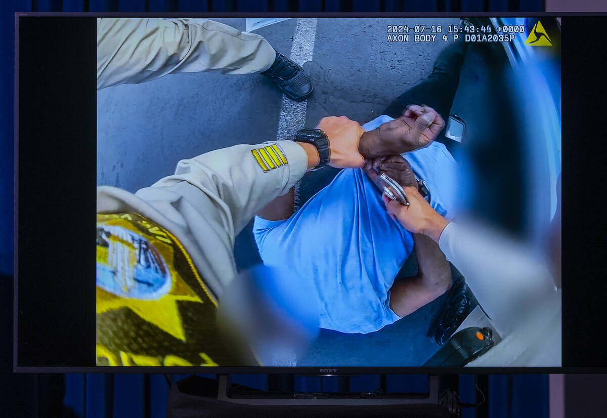 Body worn camera video of a Metro officer arresting a subject is shown during a news conference ...