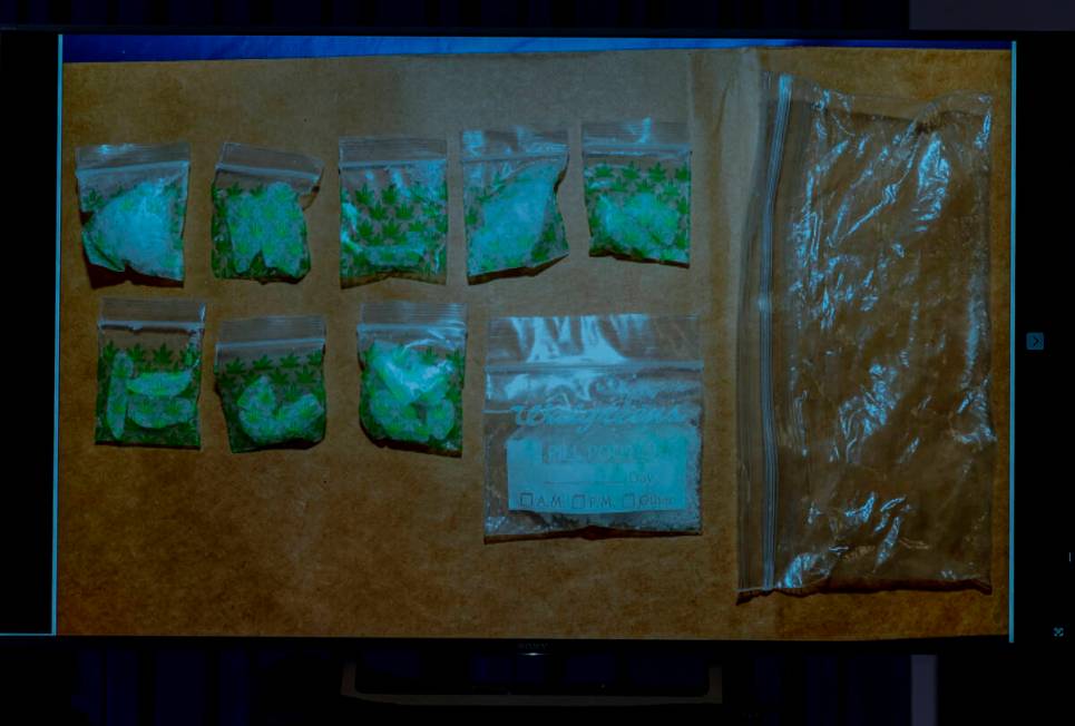 Bags of methamphetamine taken by Metro from a subject's vehicle are shown on a screen Friday, J ...