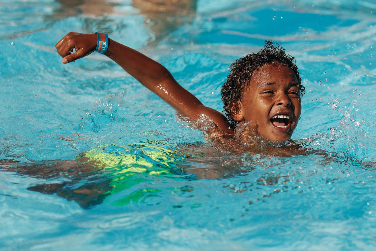 Ki Gleason-Jonea plays in the pool on Friday, June 30, 2023, at the Swim and Social pool at The ...