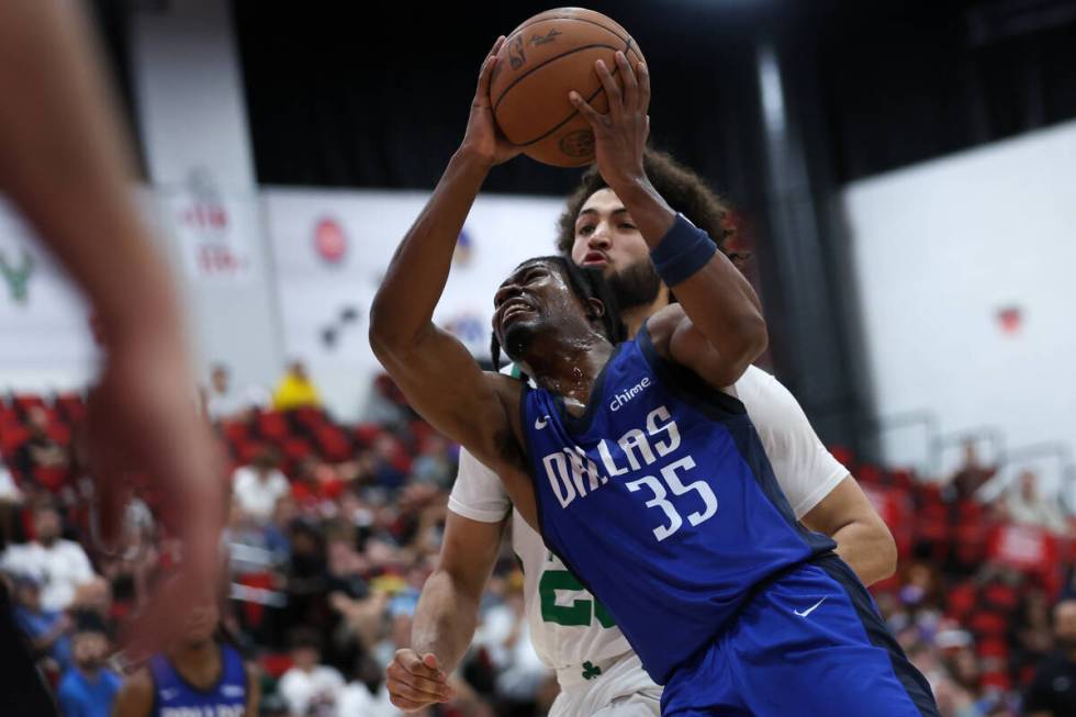 Dallas Mavericks guard TJ Clark (35) shoots against Boston Celtics forward Anton Watson during ...