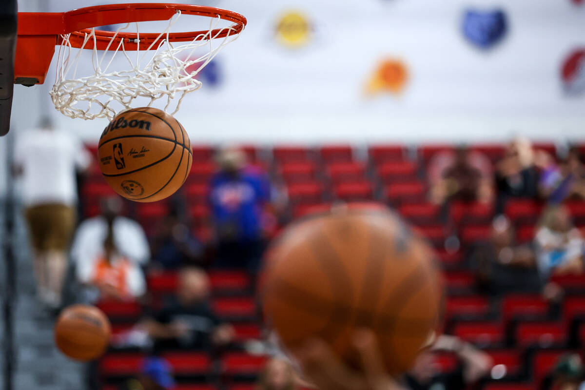 Balls float through the net while players warm up before an NBA summer league basketball game a ...