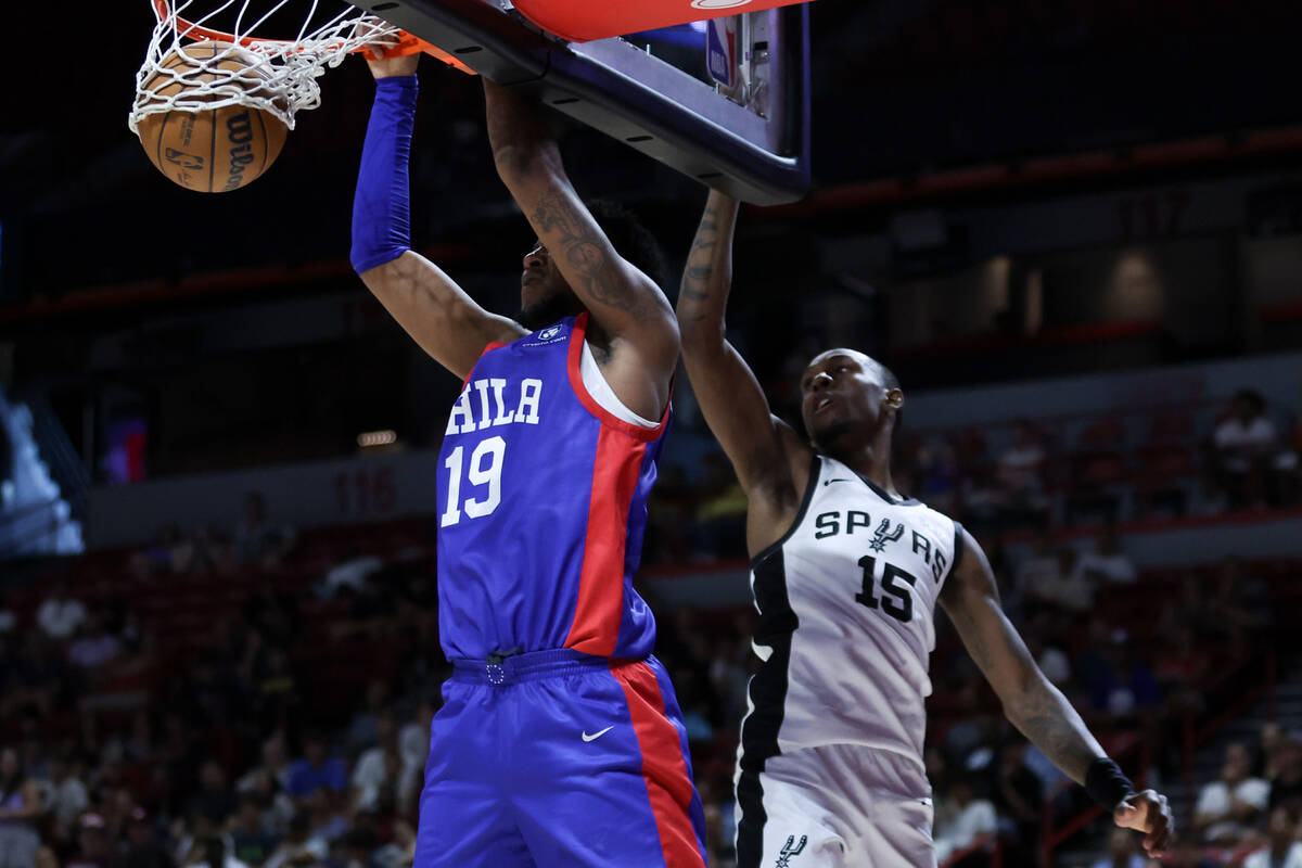 Philadelphia 76ers forward Justin Edwards (19) dunks the ball over San Antonio Spurs guard Jama ...