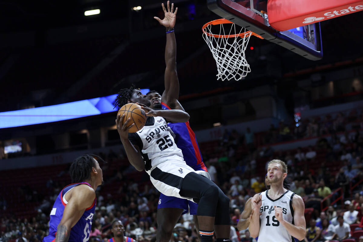 San Antonio Spurs Sidy Cissoko (25) shoots against Philadelphia 76ers center Adem Bona (30) dur ...