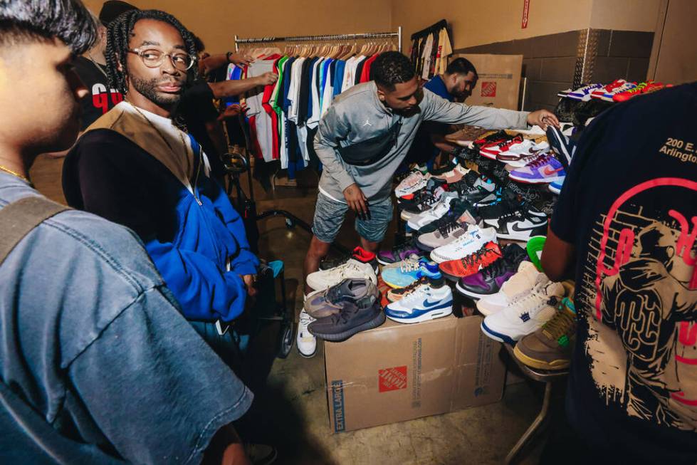 Attendees check out different shoes during Sneaker Con at the Mandalay Bay Convention Center on ...