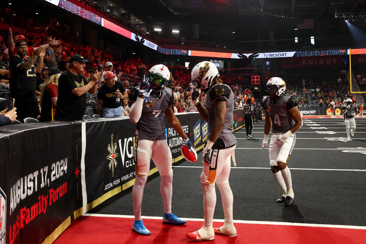 The Vegas Knight Hawks celebrate after wide receiver CJ Windham (7) scored a touchdown during t ...