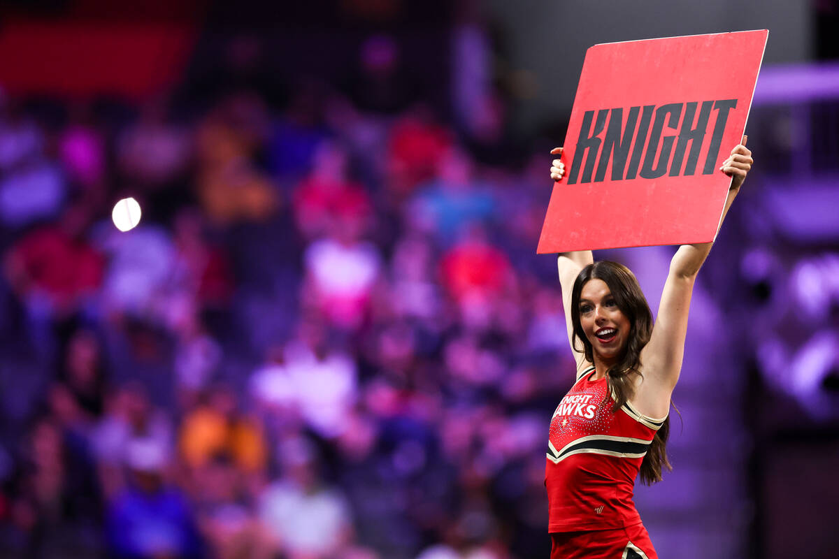 A Hawk Girl cheerleader cheers with the crowd during an IFL (Indoor Football League) game betwe ...