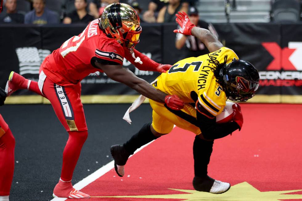 Tucson Sugar Skulls running back Devonte Sapp-Lynch (5) scores a touchdown while Vegas Knight H ...