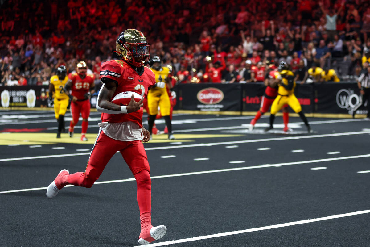 Vegas Knight Hawks quarterback Ja'Rome Johnson runs toward the end zone before scoring a touchd ...