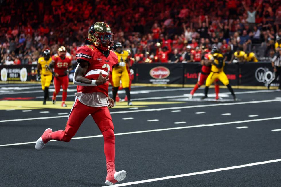 Vegas Knight Hawks quarterback Ja'Rome Johnson runs toward the end zone before scoring a touchd ...