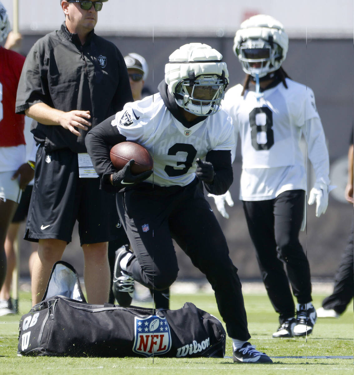 Raiders running back Zamir White (3) runs throw drills during team's practice at the Intermount ...