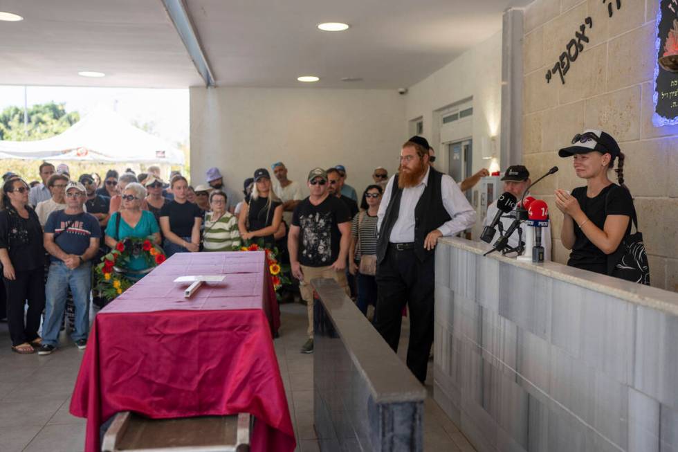 Family and friends of Yevgeny Ferde attend his funeral at a cemetery in Rishon Lezion, Israel, ...