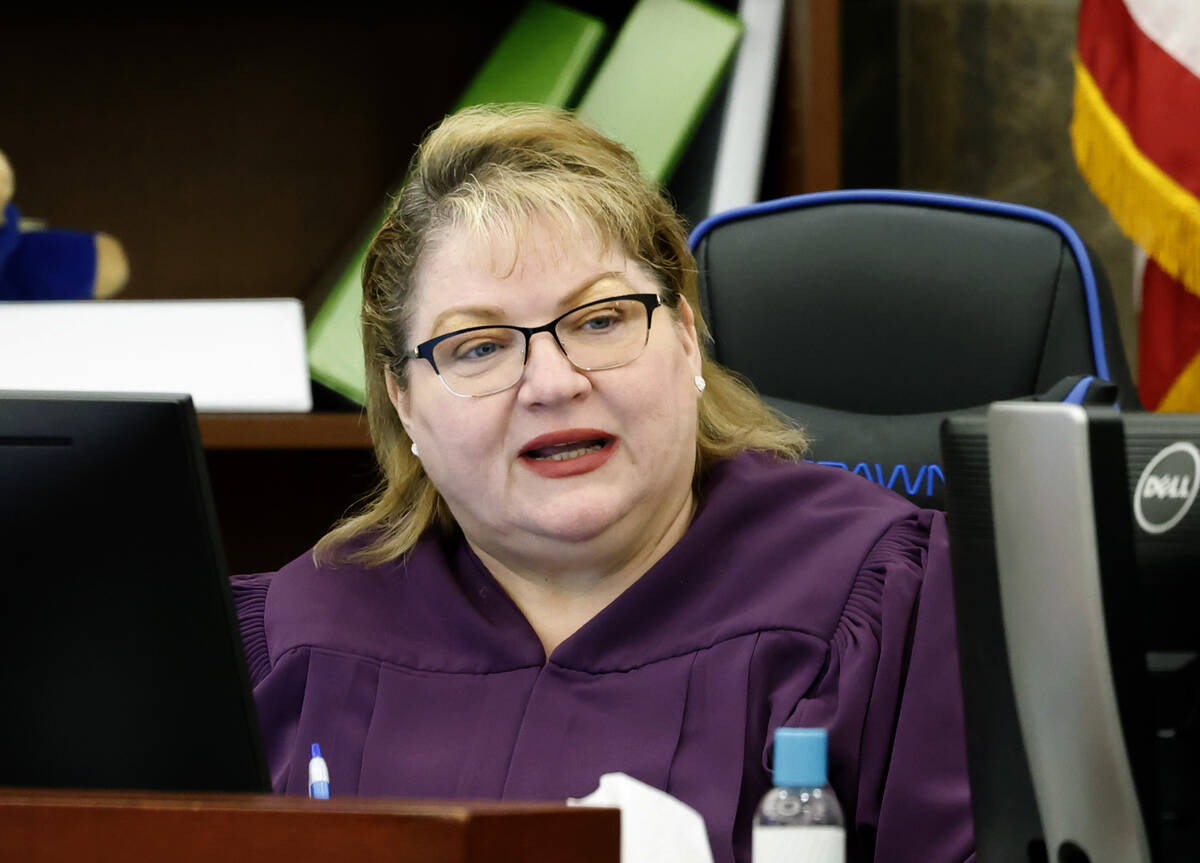 District Court Judge Dawn Throne presides over a hearing extending temporary guardianship of ch ...