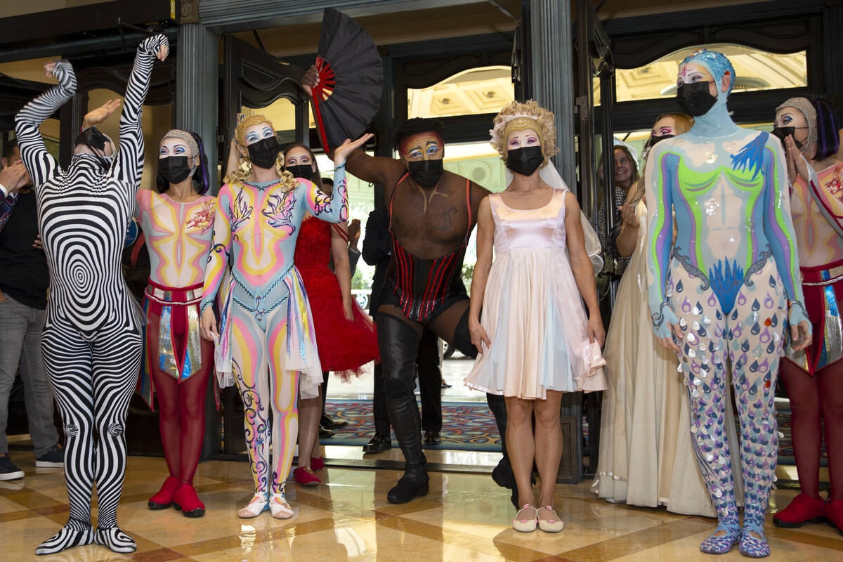 Cast members of "O" arrive for a welcome back parade at Bellagio on Thursday, July 1, ...